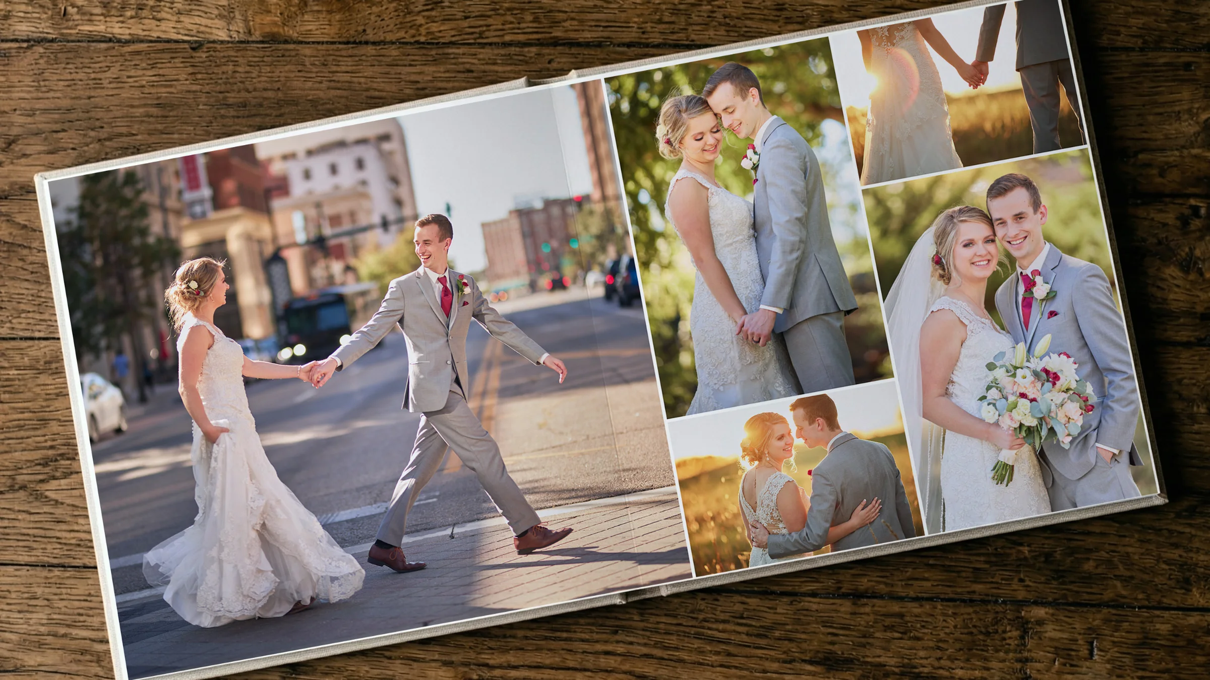 Open wedding photo album displaying a finished multi-image spread on a wooden table.